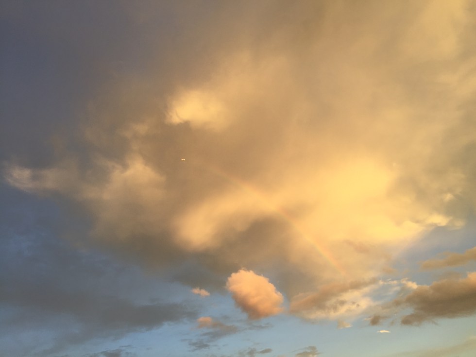 An airplane meets a rainbow